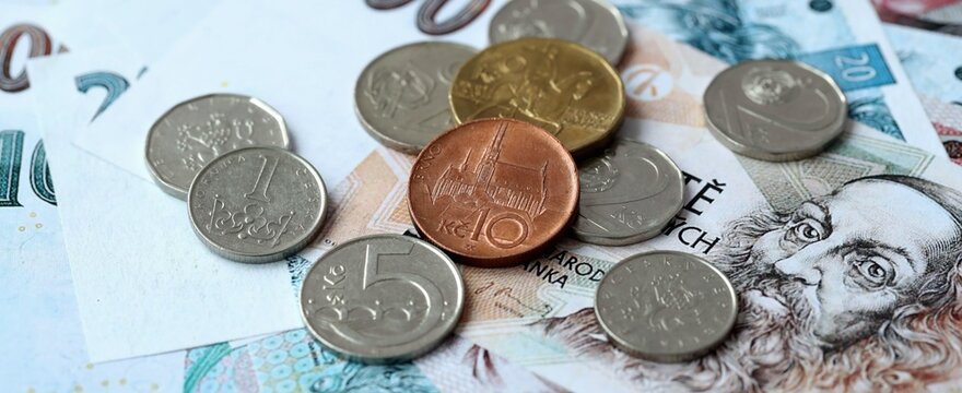 Czech koruna money bills and coins on table. Czech Republic cash of CZK currency close up