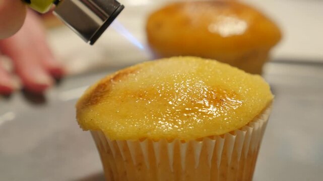 Sugared cupcake with kitchen torch