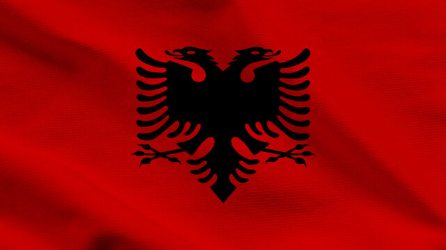 National flag of Albania with the black double-headed eagle on a red wavy fabric background. Professional top-down shot of textile ripples for national celebrations, holidays, and news media.