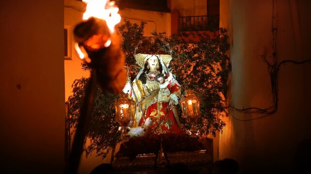 Fiesta de los Rondeles in the village of Casarabonela. A traditional virgen parade with men carrying fire torches