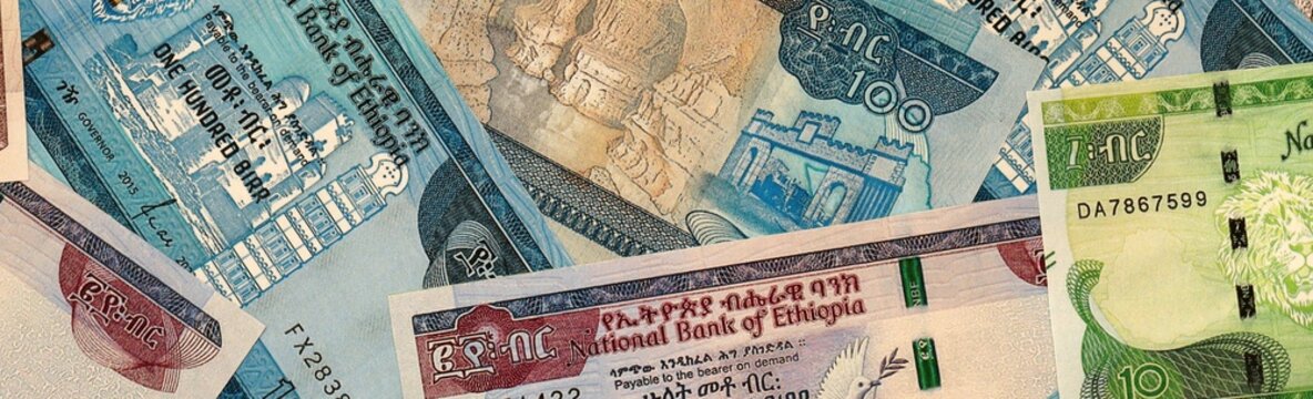 Ethiopian birr money bills in pile on table. Ethiopia ETB currency cash close up