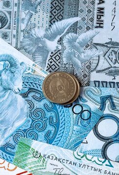 Kazakhstani tenge money banknotes and coins on table. Kazakhstan cash bills of KZT currency