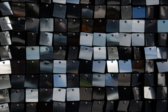 Epic black and silver sequin panel wall shimmer texture background. 
Cinematic horizontal pattern of luxury disco party crosswalk lines, 
glittering metallic mirror squares and hard shadow contrast.
