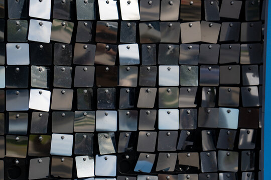Epic black and silver sequin panel wall shimmer texture background. 
Cinematic horizontal pattern of luxury disco party crosswalk lines, 
glittering metallic mirror squares and hard shadow contrast.
