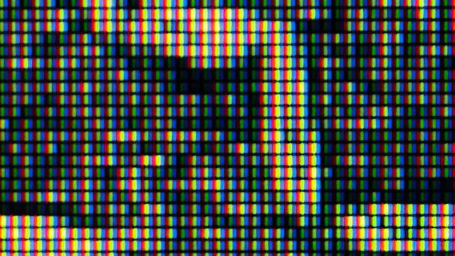 Display technology showing illuminated RGB subpixel grid macro