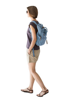 Full length portrait of a young woman walking isolated transparent PNG, student girl full body photo PNG with transparent background precisely cut out with clipping path.