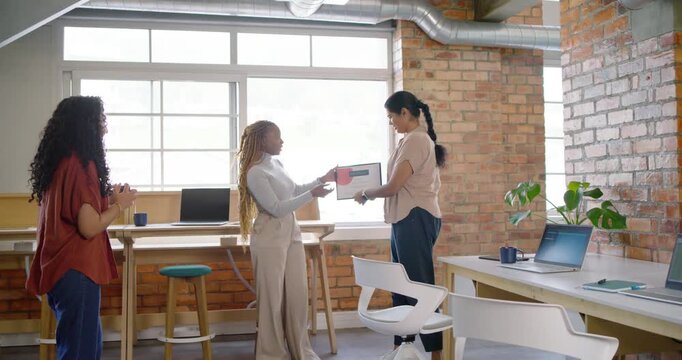 Diverse women handing framed certificate, recipient accepting award as peer using phone in office