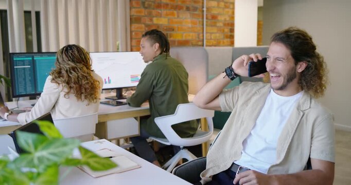 Team reviewing data at desk right male taking call, checking phone, typing on laptop, copy space