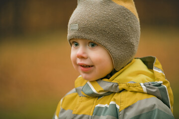 Smiling Toddler Boy in Profile with Warm Golden Autumn Bokeh Background — Child Portrait © breamchub