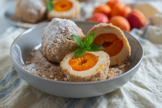 Sweet potato dumplings filled with apricots on a plate