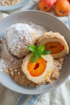 Sweet potato dumplings filled with apricots on a plate