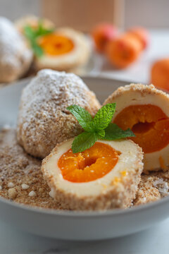 Sweet potato dumplings filled with apricots on a plate