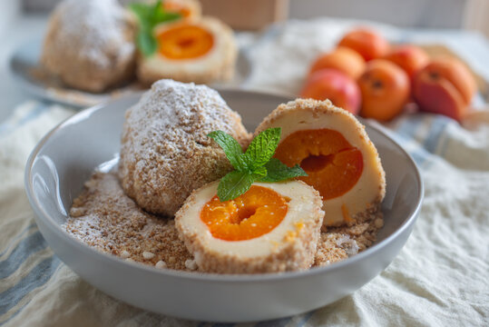 Sweet potato dumplings filled with apricots on a plate