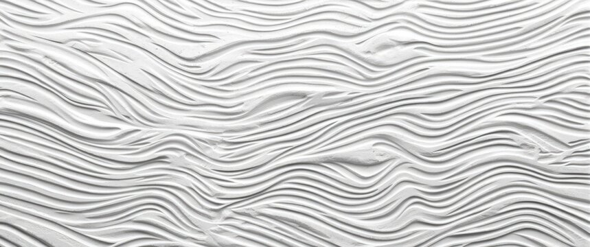 Textured white wall with flowing wave patterns