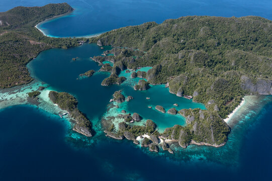 Iconic Piaynemo viewpoint landscape with tropical karst islands and crystal clear lagoons in Raja Ampat