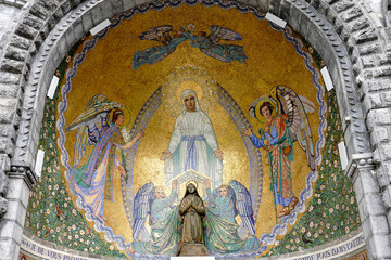 Naklejka premium France. Hautes-Pyrénées. Lourdes. A mosaic depicting the apparition of the Virgin Mary adorns the pediment of the Basilica of the Rosary