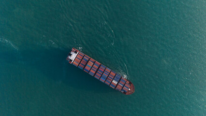 Fototapeta premium Aerial view from a container drone. Container ships in export-import and logistics business Transporting goods to large ports Worldwide shipping and logistics business International business abroad