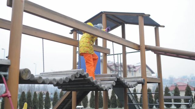 little girl playing on playground