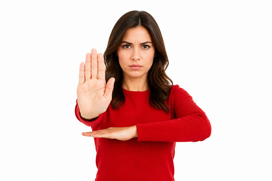 A woman in a red top is holding up one hand in a stop gesture against a white background.