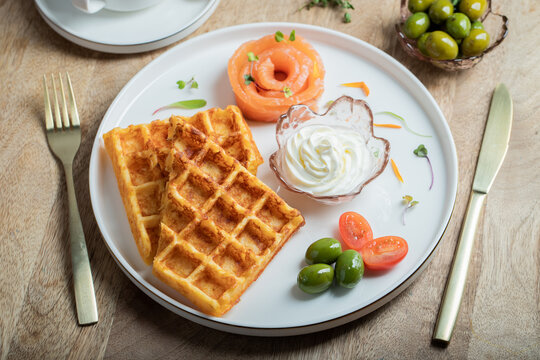 Crunchy waffle fries with sour cream dip served in a basket