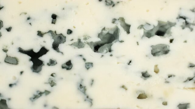 Heap of sliced blue cheeses with a noble mold, slider view