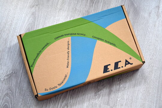 Cardboard product box from the E.C.A. brand, featuring eco-friendly slogans about water-friendly designs in multiple languages