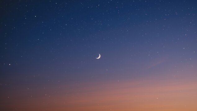 Peaceful twilight view highlighting radiant crescent moon and starry sky