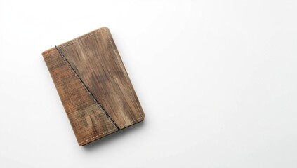 Fototapeta premium Overhead perspective of recycled stitched cover notebook on plain white background