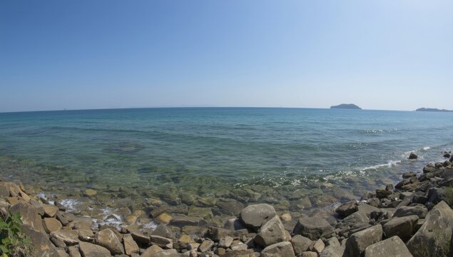 Panoramic Korean shoreline with clear ocean waters and rocks