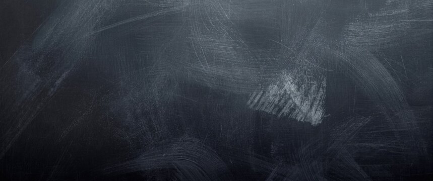 Textured black chalkboard surface with scratch marks