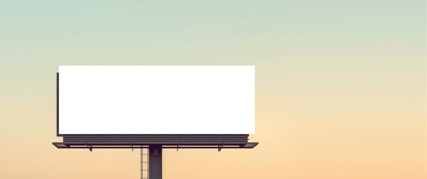 Empty billboard against a pastel sunset sky