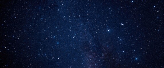 Fototapeta premium Night sky filled with stars and distant galaxies