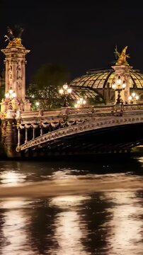 Bastille Day Paris Seine river at night, Pont Alexandre III illuminated, golden lamp posts reflected in dark water, romantic cinematic scenic b-roll France July 14