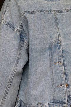 Back detail of denim jacket with seams