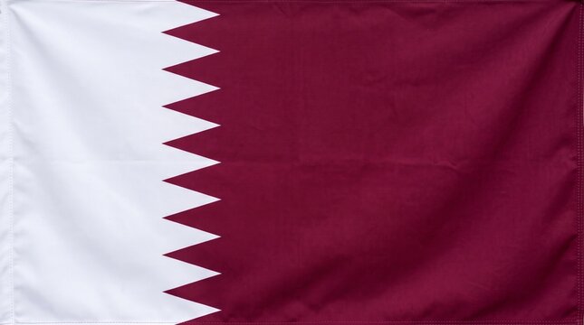 "Qatar&rsquo;s maroon and white flag with serrated edge, symbolizing heritage, sovereignty, and Gulf identity, distinctive design reflecting history, culture, and national pride with elegance."