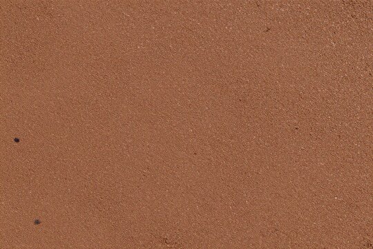 a close up of a brown carpet with a white background