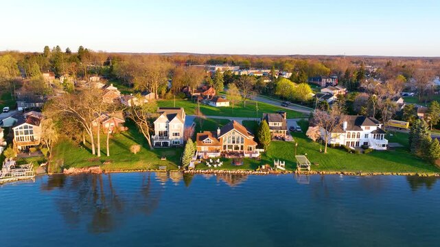 Waterfront residential houses aerial view in the morning on Walled Lake in city of Walled Lake, Michigan MI, USA. 