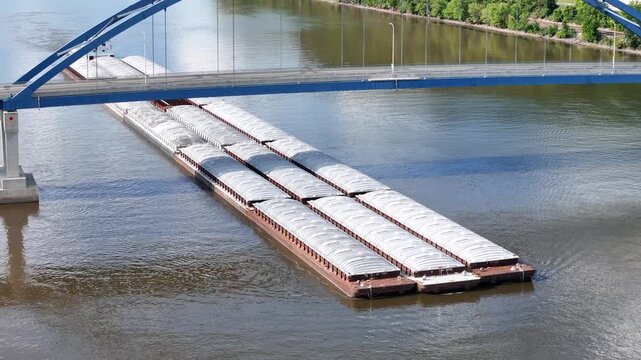 Large river barge set passing under blue steel arch bridge Part 2