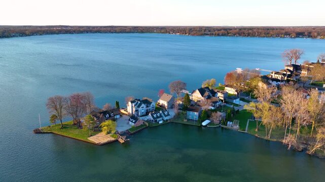 Waterfront residential houses aerial view in the morning on Walled Lake in city of Novi, Michigan MI, USA. 