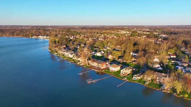 Waterfront residential houses aerial view in the morning on Walled Lake in city of Novi, Michigan MI, USA. 