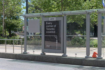Obraz premium Astral Media (Bell) OOH transit shelter with poster for Uber in Toronto