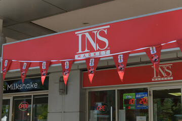 Obraz premium FIFA World Cup Coca-Cola bunting outside INS Market, a convenience store chain, located here at Waterclub Condominiums, Queens Quay W, Toronto