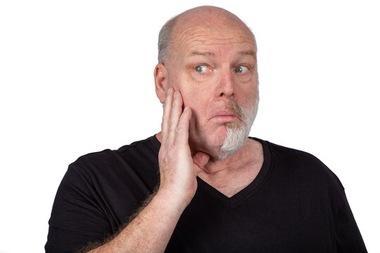 Senior Bald Man With Skeptical Expression Touching Cheek Isolated on White Background