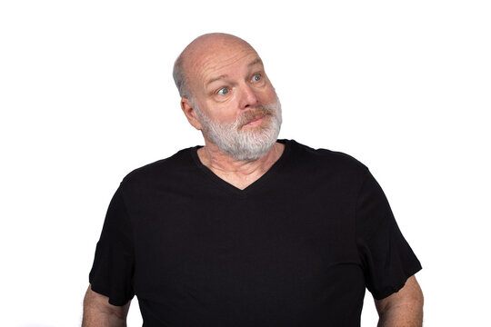 Bald Bearded Man Looking Sideways with Skeptical Amused Expression Isolated on White Background