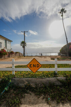 Road end warning sign near the beach