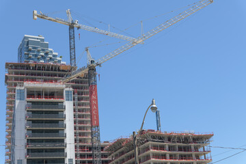 Obraz premium construction of Pinnacle Lakeside Residences at 215 Lake Shore Blvd E - looking east - to construction cranes and banner, Toronto