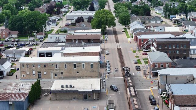 Freight train moving through the center of the city of Bellevue, Iowa