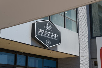 Obraz premium abstract view of building exterior and sign: Dream Cyclery, a bicycle shop, located here at 396 Queens Quay W, inside The Quay, Toronto Waterfront Apartment Rentals