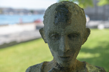 Obraz premium haunting bronze sculpture (The Orphan Boy) by Irish sculptor Rowan Gillespie at Ireland Park, a powerful waterfront memorial at Éireann Quay, Toronto