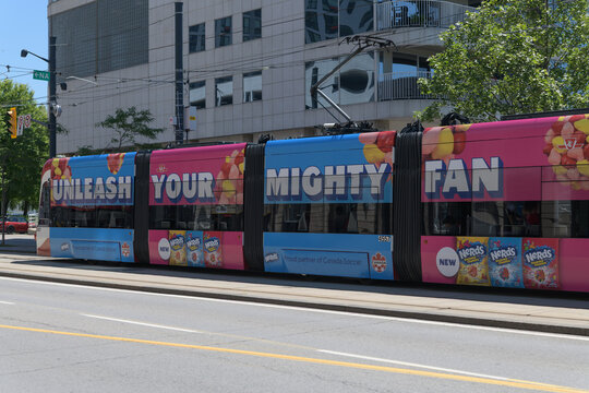 wide view of "Unleash Your Mighty Fan" trolley wrap,  part of a marketing campaign by the candy brand NERDS (owned by the Ferrara Candy Company) on a streetcar in Toronto